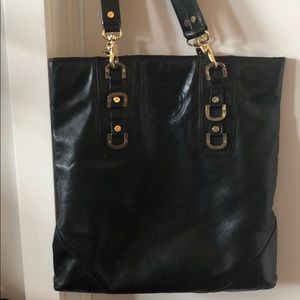 Tory Burch black leather purse.